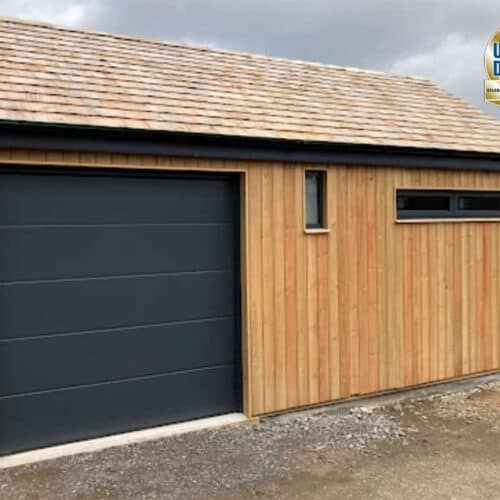 AluTech L Rib Insulated Sectional Door in Anthracite Grey on Timber Building