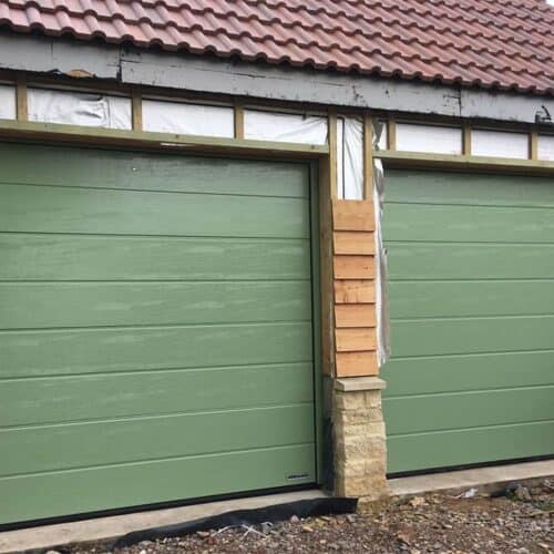 Pair of Pale Green Hormann Sectional Garage Doors
