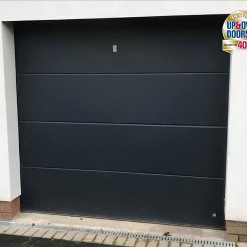 Ryterna Flush Insulated Sectional Door in Jet Black with External Emergency Release